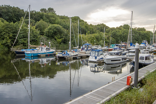 Jetty at Cardiff Marina in Wales, UK, with private boat names visible.