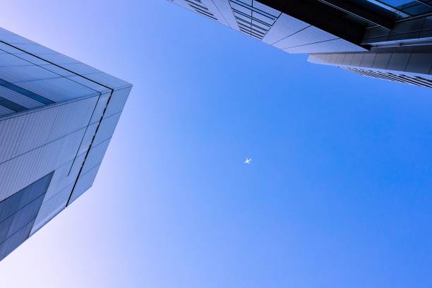 istock Low angle shot of two skyscrapers on a blue sky background 1459310797
