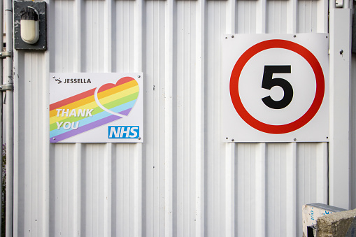 'Thank You NHS' Sign at Cardiff Bay in Glamorgan, Wales, with the NHS logo visible as well as Jessella.
