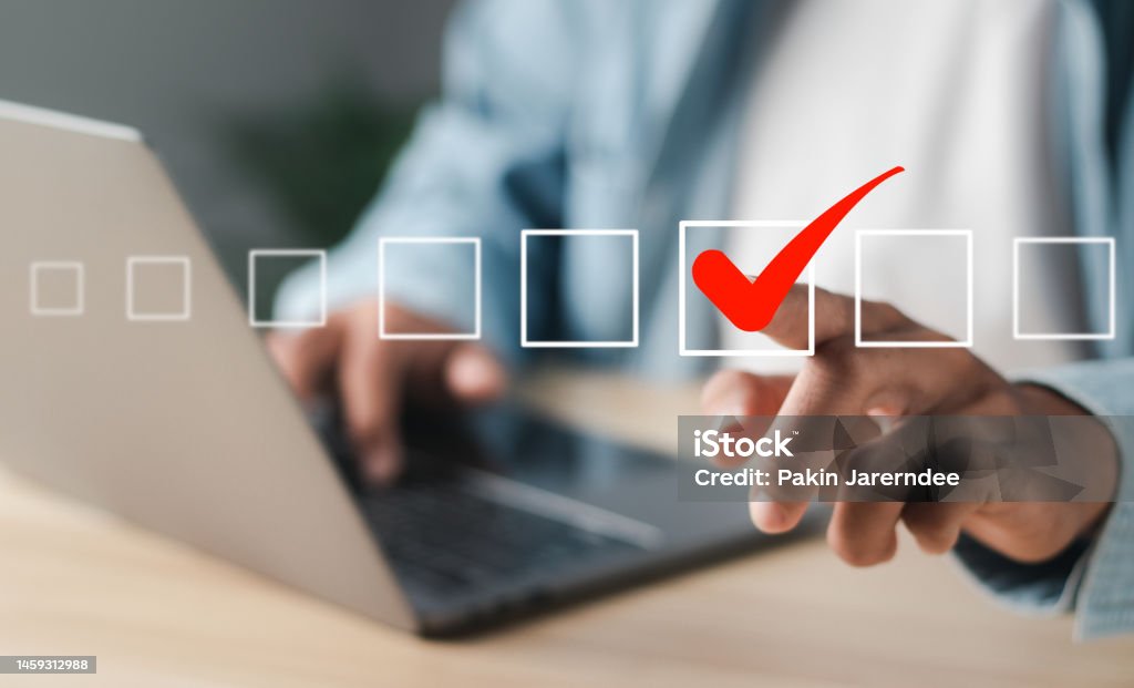 Businessman touching square box with correct icon on virtual interface. Decisions Stock Photo