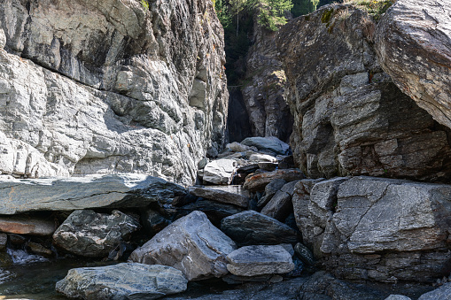 Lillaz waterfall (Cascate di Lillaz) bed, dried up this season, divided by thousands of years of formation in granite alpine rocks, Aosta valley, Italy