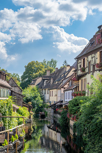 La Petite Venise Colmar city street view in the French Alsace during a summer day. Colmar is famous for its traditional architecture with timber framing in the old town and canals that run through the city. This area is called Little Venice.