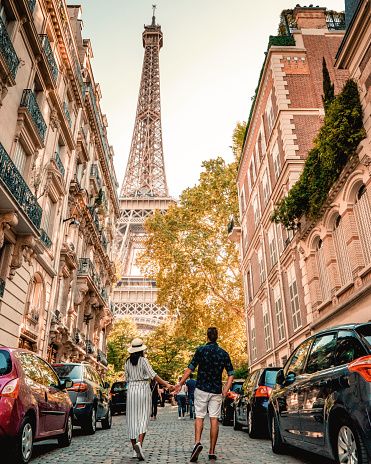 couple men an woman honeymoon Paris Eiffel tower France,couple men and woman city trip in Paris during Autumn