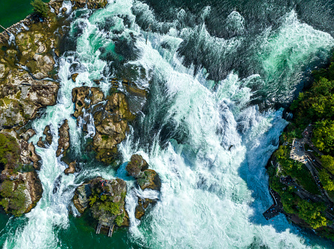 Rhine Falls waterfall in Schaffhausen, Switzerland seen from above. The Rheinfall in the river Rhine is the most powerful waterfall in Europe.