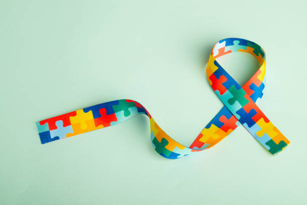 istock World Autism awareness and pride day with Puzzle pattern ribbon 1459317992