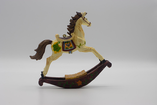 Miniature rocking horse. Rocking horse ornament on white background