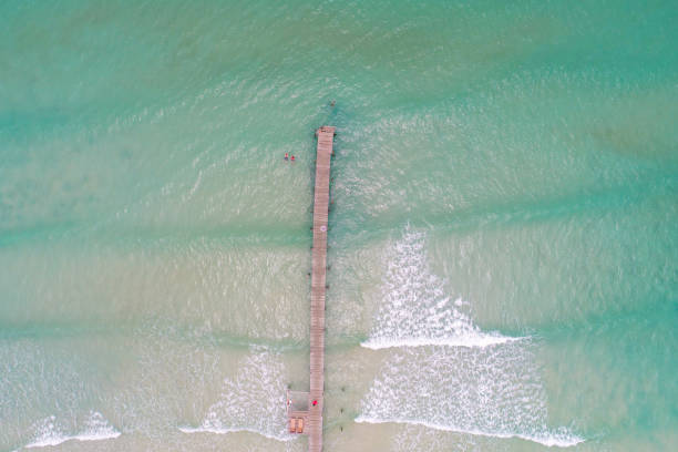 istock Aerial view white snad beach wave turquoise water 1459319764