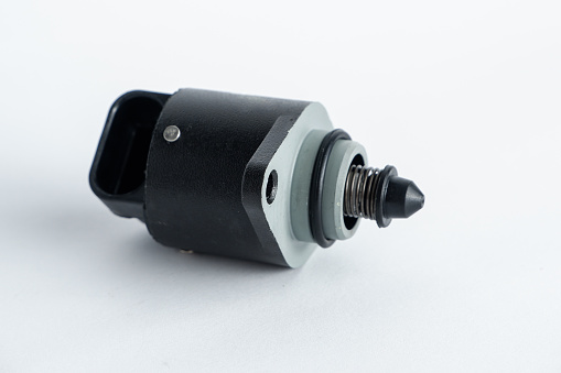 Car injector engine idler . idle speed sensor. idle speed controller close up on white background