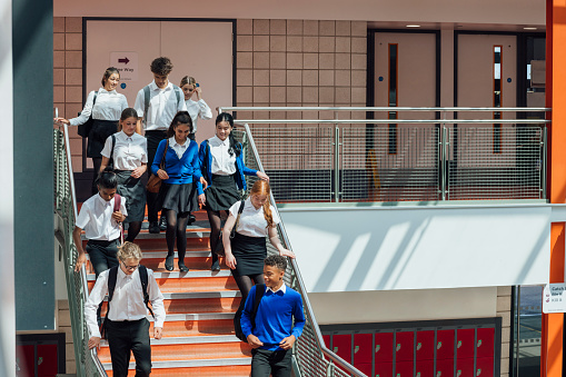 Students standing still at hallway of school