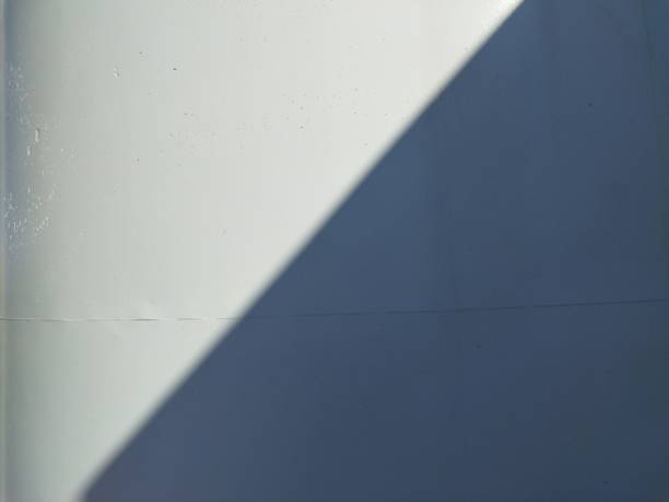 istock white wall with a straight shadow of black color 1459324316