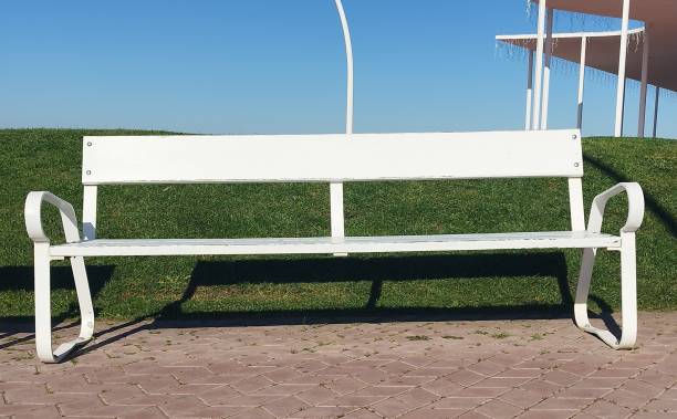 istock white metal bench on the promenade 1459324352
