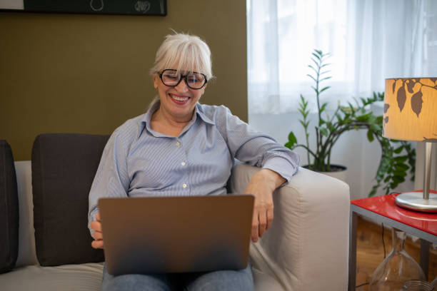 istock Mature Woman Using Laptop 1459324374