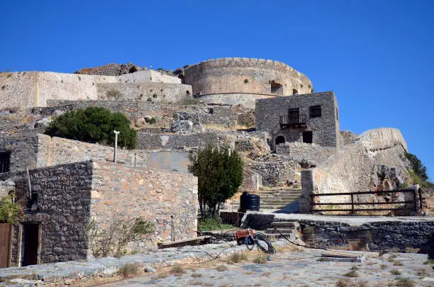 Greece, Crete, buildings built of stone in old Venetian Fortress Spinalonga, until 1957 used as a leper station, now a popular tourist destination