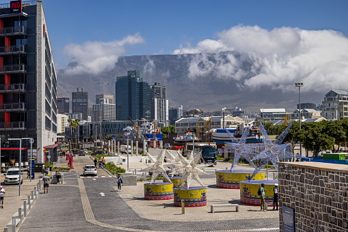 Cape Town, South Africa - December 9th 2022: Scene from the Victoria and Alfred waterfront which has been converted to a modern part of downtown Cape Town