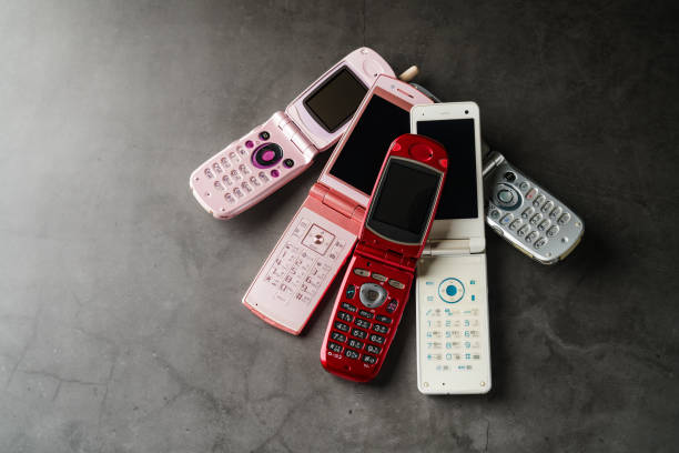istock Old used cell phone on dark background 1459328316
