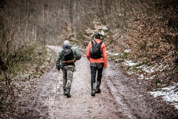 istock Two tourists hiking on a mountain trail 1459328691