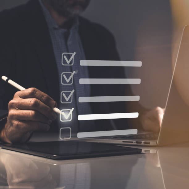 istock Businessman tick sign mark for assessment. Questionnaire, quality evaluation concept. Online survey 1459328706