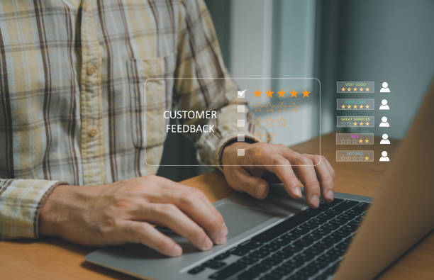 istock Selective focus at finger of business man while point finger to choose feedback on excellent customer service with five star score with smile. Service evaluation concept with futuristic icon. 1459329800