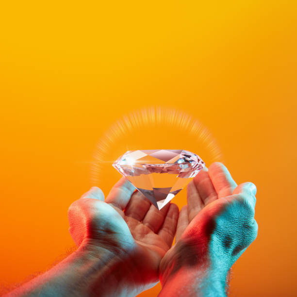 Beautiful sparkling diamond in hand