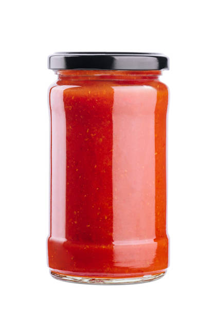 istock Tomato paste in a glass jar on a white background 1459331325