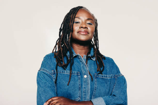 istock Confident woman with dreadlocks looking at the camera in a studio 1459331867