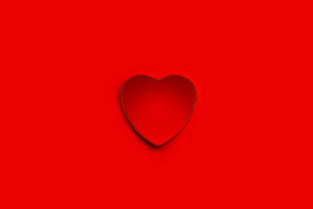 istock Interior of a heart shape open box on a red background with copy space in a top view 1459332721