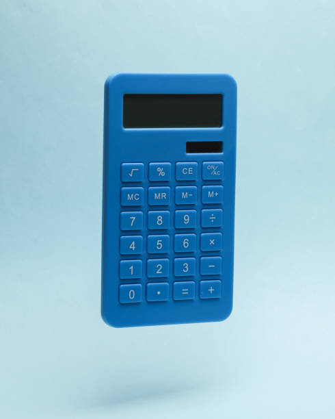 Blue calculator levitates on a blue background stock photo
