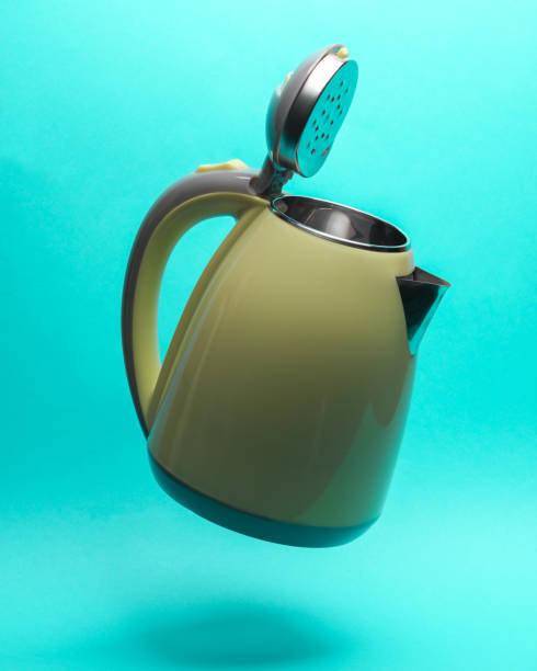 istock Electric kettle levitates on a blue background 1459334951