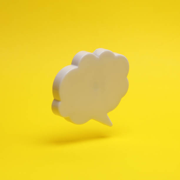 istock Speech bubble floating in the air on a yellow background with a shadow. Creative idea. Minimal concept. Levitating objects 1459334985