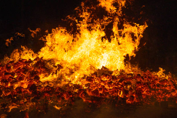 Fire by night. Flames and embers. Hell and inferno