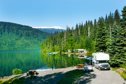 Camping by the beautiful mountain  lake in the summer along Alaska Highway