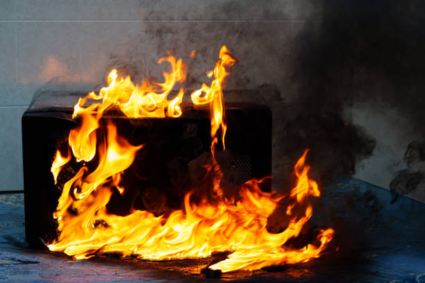 istock microwave oven on fire. the concept of fire in the kitchen. 1459337710