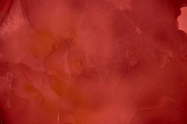 istock Red stained and cracked frosted glass texture for background 1459337768