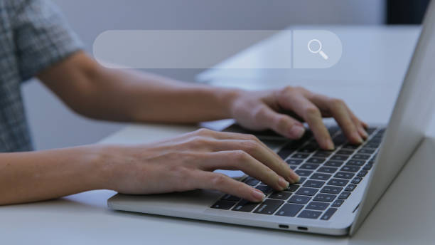 istock Woman hand using laptop or computor searching for information in internet online society web. Searching information data on internet networking concept. Data Search Search Engine Optimization. 1459343349