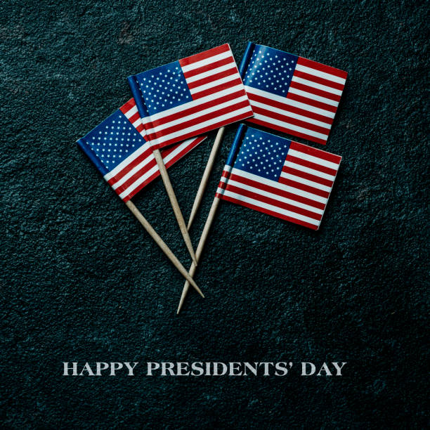 istock text happy presidents day and american flags 1459343419
