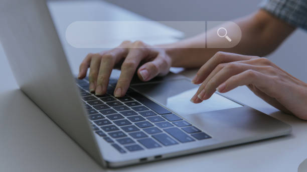 istock Woman hand using laptop or computor searching for information in internet online society web. Searching information data on internet networking concept. Data Search Search Engine Optimization. 1459343452