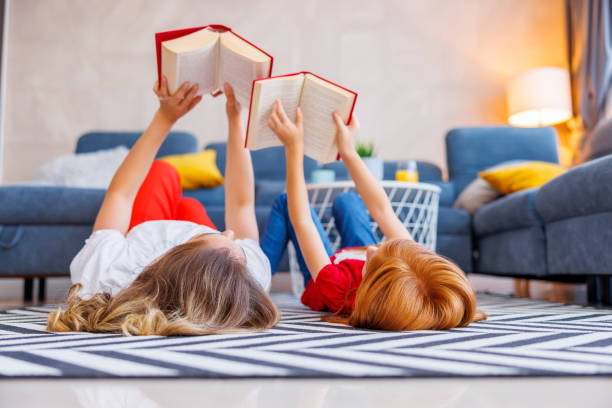 istock Mother and daughter reading books 1459343887