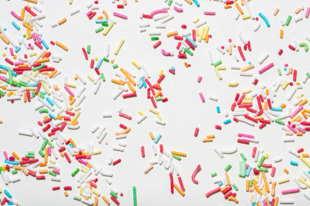 istock Photo of confectionery sprinkles on a light background. Texture, pattern. 1459344365