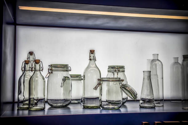 A group of glass containers, bottles and jars in a modern kitchen