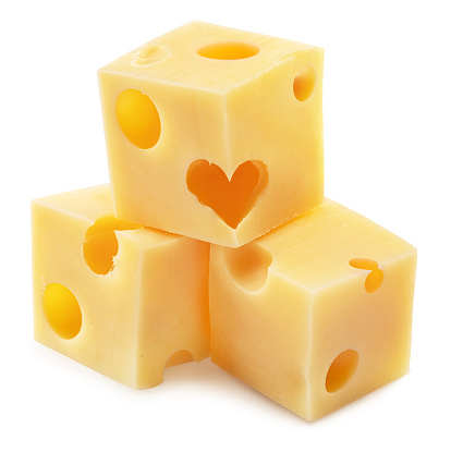Pyramid of Emmental cheese cubes with heart isolated on white background. File contains clipping path.