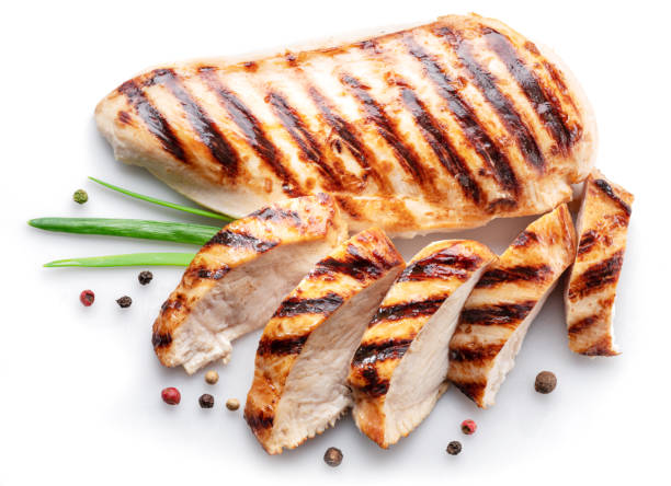 istock Grilled chicken fillet with herbs isolated on white background. 1459347185