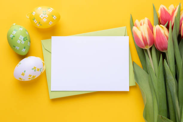 istock Template for Easter greeting card. Blank card with an envelope and bouquet of tulips 1459347418