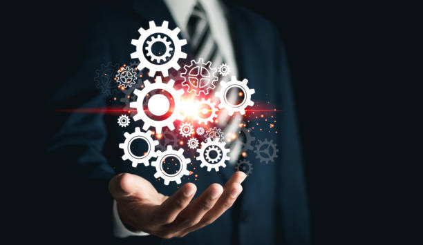 istock Businessman with gears on virtual interface. Business process analysis and innovation with global network connectivity. Concept for success. 1459347845