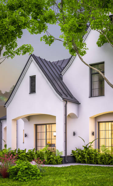 istock 3d rendering of white and black modern Tudor house in evening 1459347962