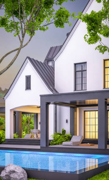 istock 3d rendering of white and black modern Tudor house in evening 1459347995