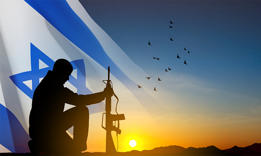 Silhouette of soldier kneeling down on a background of sunset and Israel flag. Greeting card for National Holidays. EPS10 vector