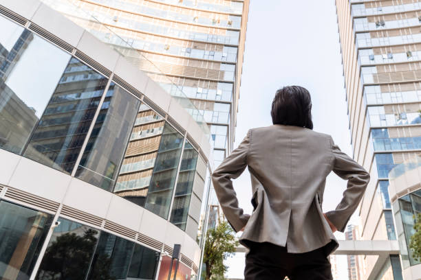 istock Rear view of Man looking at city 1459351191