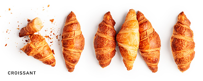 Fresh croissants collection and creative layout isolated on white background. Healthy eating and sweet food concept. French breakfast. Top view, flat lay. Design element