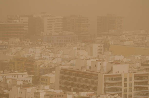 City under a dense haze formed by airborne dust. stock photo