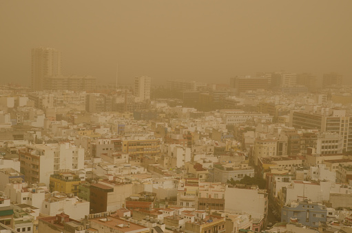 City of Las Palmas de Gran Canaria under a dense haze formed by airborne dust. Gran Canaria. Canary Islands. Spain.